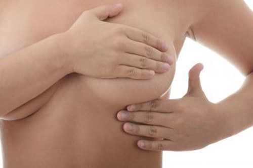Почему после овуляции болит грудь